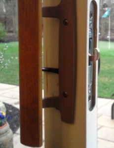 Residential patio door lock set on a sliding door Residential patio lock set