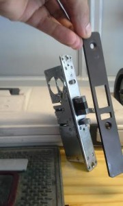 Here are the lock mechanism and the new security plate before installation.