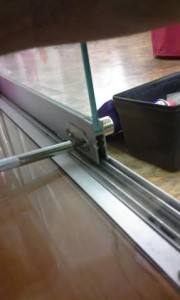 I'm taking the screws out from the inside of the sliding door.